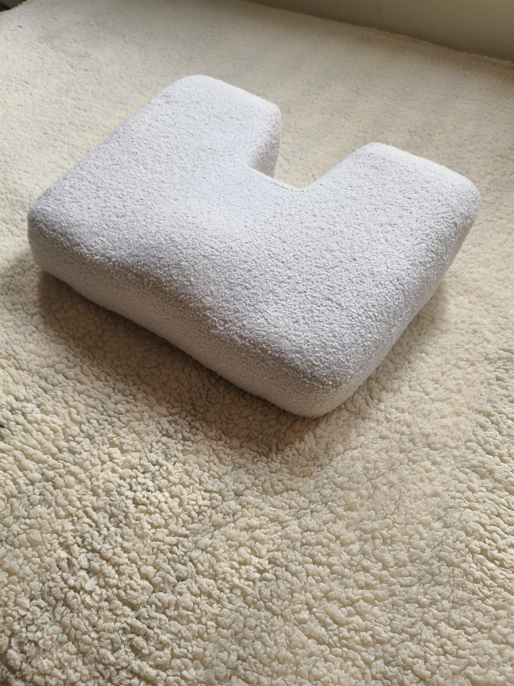 Découpe en U du coussin PosturLabs vue de dessus
